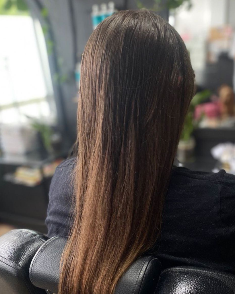 Long brown hair after detangling at FREAK SALON